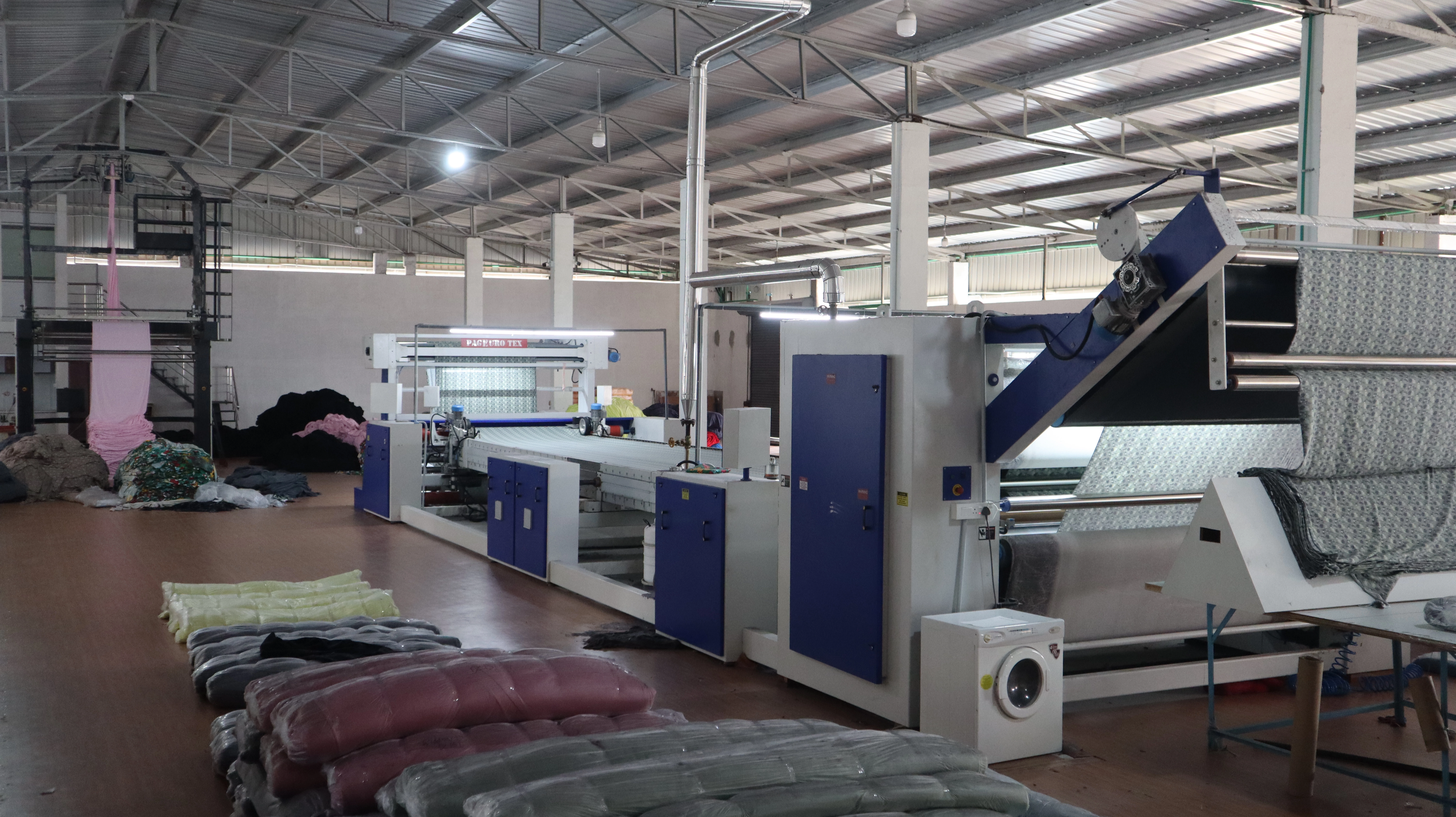 A modern factory floor representing our textile machinery business